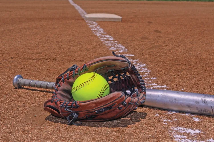 West Suburban softball gets one more game, win